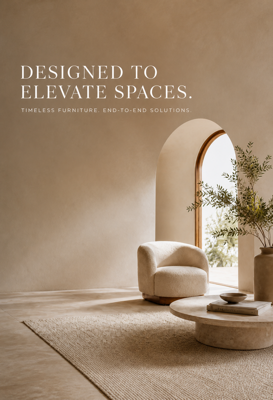 A styled interior scene with a cream upholstered accent chair beside a round stone coffee table and a large woven rug, set in a warm beige room with an arched window and text reading 'DESIGNED TO ELEVATE SPACES.'.