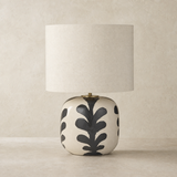 Aleah Ceramic Lamp on warm beige plaster and limestone background