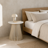 Amalfi side table styled as a bedside table in a European minimalist bedroom