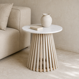 Amalfi marble and pale oak side table styled in a warm Mediterranean living room