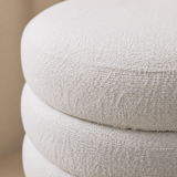 Ambasciata ottoman close-up showing ivory bouclé texture and sculptural seam