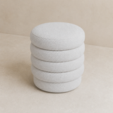 Ambasciata ivory bouclé ottoman from an elevated three-quarter angle
