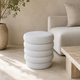 Ambasciata ivory bouclé ottoman styled in a warm Mediterranean living room
