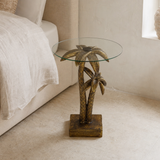 Antigua sculptural palm side table in a boutique hotel bedroom