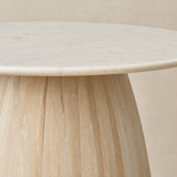 Arezzo dining table close-up of the marble edge and washed timber pedestal