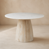 Arezzo round marble and timber dining table in a warm beige studio