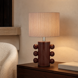 Arizona Ceramic Lamp illuminated in a refined European reading corner