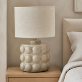 Aspen Resin Lamp Ivory Small from an alternate angle in a minimalist bedroom