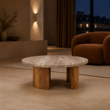 Aurelia Marble and Curved Acacia Coffee Table in an elegant European evening interior