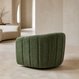Rear three-quarter view of Aurelia Sculptural Swivel Chair in a European minimalist interior