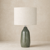 Bali Rattan Lamp with ivory linen shade in a warm beige studio