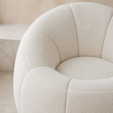 Bambolina Armchair close-up of ivory teddy boucle and petal seam detail
