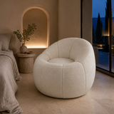 Bambolina Teddy Boucle Armchair in a serene Mediterranean bedroom at blue hour