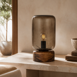 Belize lamp with smoked glass cloche and wooden base in a premium Mediterranean interior