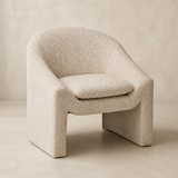 Bergamo cream upholstered armchair in a warm beige Elara studio