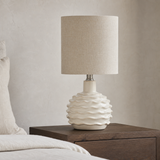 Bern Green ceramic table lamp from an alternate angle in a minimalist bedroom
