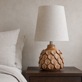 Bern Yellow ceramic table lamp from an alternate angle in a minimalist bedroom
