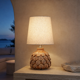 Bern Yellow ceramic table lamp glowing at blue hour in a Mediterranean interior
