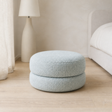 Bianca Round Boucle Ottoman in a serene European bedroom setting