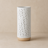 Bolla Porcelain and Wood Lamp on a warm beige Elara studio background
