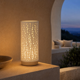 Bolla Porcelain and Wood Lamp illuminated at blue hour
