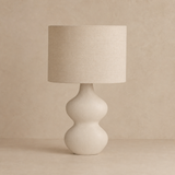 Bondi Rattan Lamp on a warm beige Elara studio background