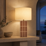 Boyd Ceramic Table Lamp Brown glowing in Mediterranean blue-hour interior