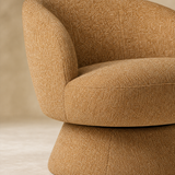 Close-up of Bressanone camel flecked upholstery seat and pedestal finish