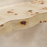 Close-up of Burley pale timber grain, organic edge and dark burl knots