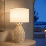 Cali rattan table lamp illuminated in a Mediterranean interior at blue hour