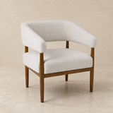 Campania ivory textured chair with walnut frame in a warm beige studio