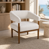 Campania occasional chair in a refined European coastal reading corner
