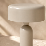 Close-up of Capri lamp ivory ceramic glaze, rounded neck and solid shade