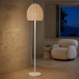 Carter beaded floor lamp illuminated in a Mediterranean interior at blue hour