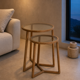 Castello oak and glass nesting tables in a European interior at blue hour
