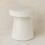 Chiana shell mosaic pedestal table in a warm beige studio