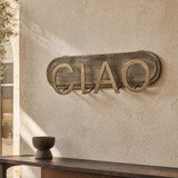 Ciao metal wall artwork in a refined European gallery interior