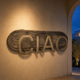 Ciao metal wall artwork in a Mediterranean blue-hour setting