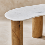 Close-up of the Como white marble top and natural timber legs