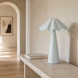 Dawson ceramic lamp on a travertine console in a European hallway