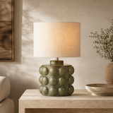 Drift olive resin table lamp in a premium Mediterranean living room