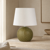 Drift Medium olive resin globe lamp in a premium Mediterranean living room