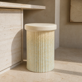 Duca fluted ivory pedestal stool in a premium Mediterranean interior