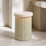 Duca fluted ivory pedestal stool in a refined European interior