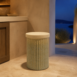 Duca fluted ivory pedestal stool in a Mediterranean villa at blue hour