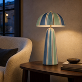 Eden Ceramic Lamp Multi illuminated in a European reading nook at blue hour
