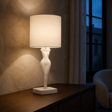 Elle Table Lamp illuminated in a European interior at blue hour