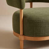 Close-up of Emerald Sovereign Chair forest green fabric and natural oak joinery