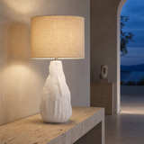 Etna Ceramic Table Lamp illuminated in a European interior at blue hour