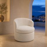 Fenice Round Boucle Ottoman seat in a blue-hour Mediterranean interior
